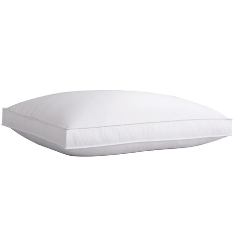 One PureAssure Allergen Barrier Down Alternative 2" Gusset Pillow on a white background, laying flat. You can see the rectangular shape that is made by the stitching around the ends.