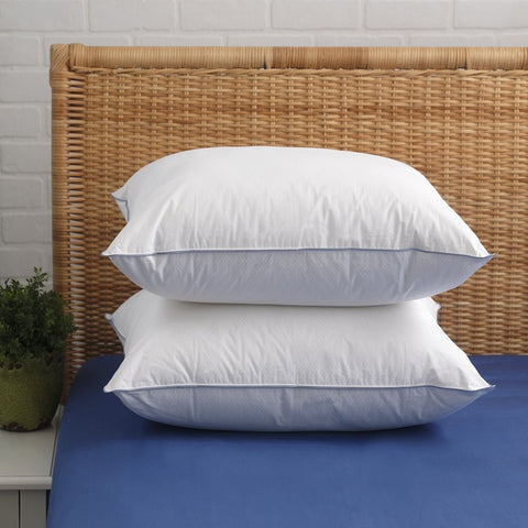 Two Down-Alternative Cooling Pillows laying on top of each other. Crafted from 100% cotton and enhanced with innovative Phase Change Material (PCM) 