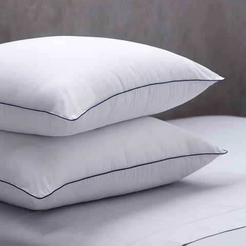 Two Cozy Clouds Microfiber Pillows laying perfectly on top of each other. Both with a dark line going along the side of the pillows.