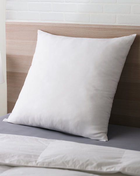 The Polyester Euro Pillow instead of the classic pillow which is rectangular, the Euro Pillow is squared. There is one in the image leaning on a headboard.