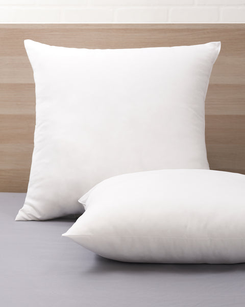 The Polyester Euro Pillow instead of the classic pillow which is rectangular, the Euro Pillow is squared. There are two in the image one up right and the other laying flat in front of it.