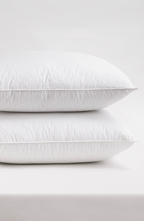 Herringbone Quilted Pillow 2-Pack one on top of the other on a white background. The pillows have several horizontal lines running across it, with V shapes alternating facing up and down.