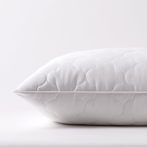 Side profile of the Billowy Clouds Pillow with 4 inch quilted cloud pattern and is filled with high-quality, gel-fiber polyester filling with a 300 thread count cotton.
