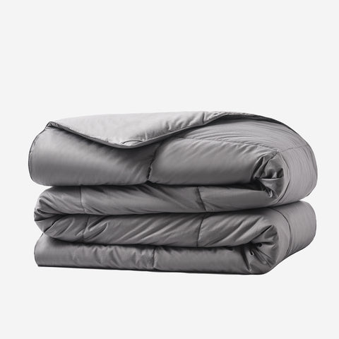 White background, with folded Graphene Comforter aka the CharcoBlanket. With 420 thread count cover fabric.