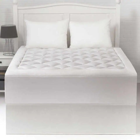 Cozy Comfort Cotton Mattress Pad with diamonds going along the top. The sides have no design. The product is white.