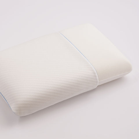 An image of the pillow is shown with some of the pillow stitching out of the cover. The cover has a blue line on the shorter end. Across the entire surface of the cover is mini square stitching. However, the part of the pillow that is sticking out, is completely white with no special stitching/design on the top.
