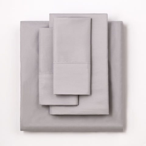 On a white background we have a full set of the Silver colored Microfiber Sheet Set. All perfectly folded up and layered on top of each other.