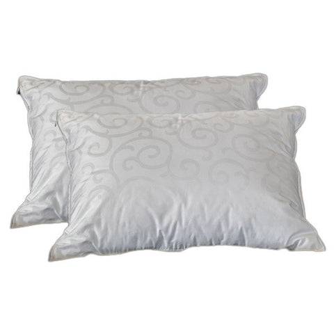Two pillows on a white background. The pillows are a darker shade of white, with swirly shapes all over the surface.