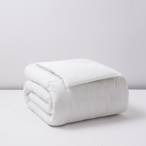 Classic Peachy Down Alternative Twin Comforter. Despite the name "peachy" the color of the blanket is in fact white. Large blanket folded elegantly. 