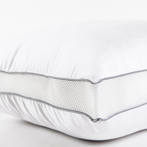 PowerNap Celliant Fiber Blend Pillow (Soft) (Set of 2). Zoomed in on one side of a pillow, where there are two blue parallels lines with little dots filling up the space between.