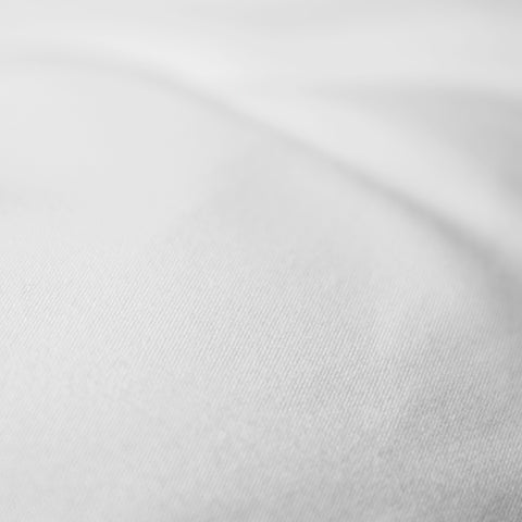 DownLinens 300 Thread Count Luxury Mattress pad extremely zoomed in. With 300 thread count 100-percent cotton jacquard scroll pattern.