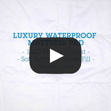 A video showcasing, DownLinens 300 Thread Count Luxury Mattress padzoomed in to the corner with large squares. With 300 thread count 100-percent cotton jacquard scroll pattern.